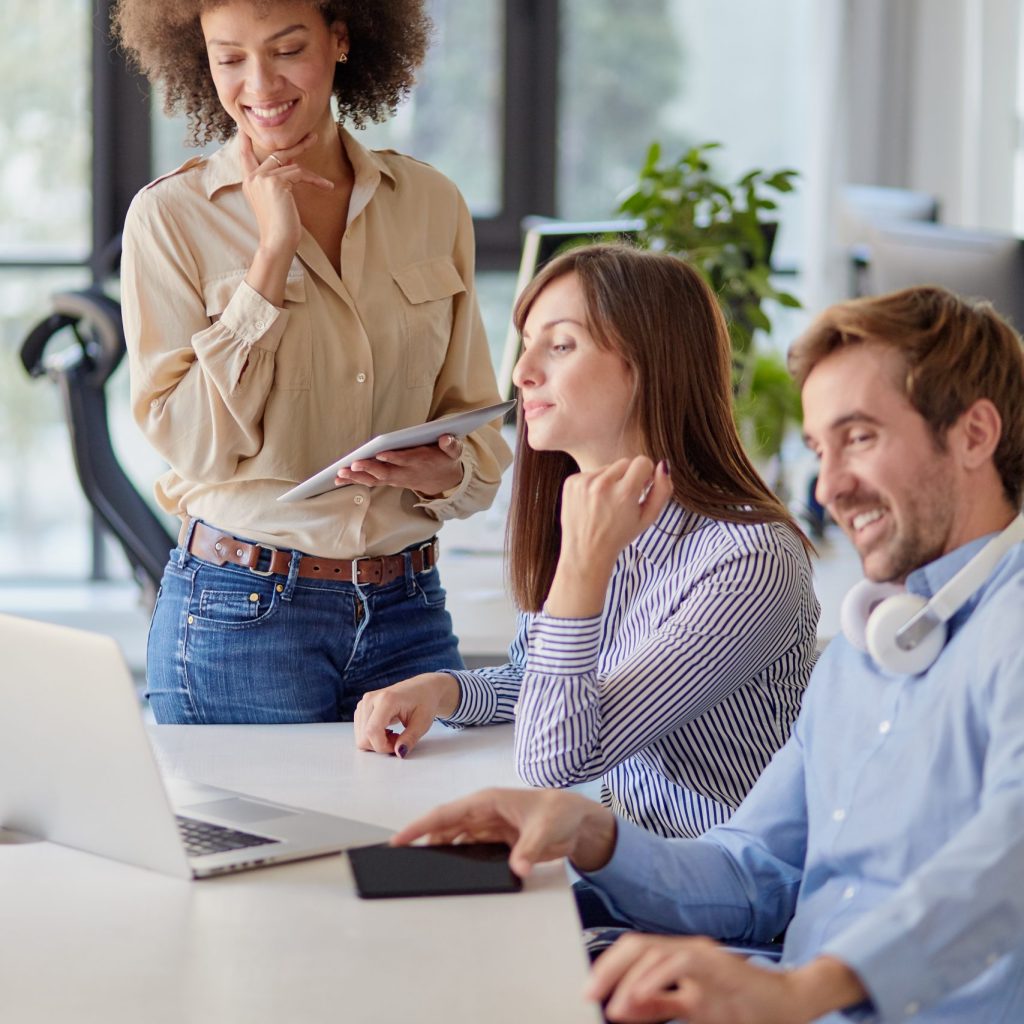 Startup concept - creative team talking in office